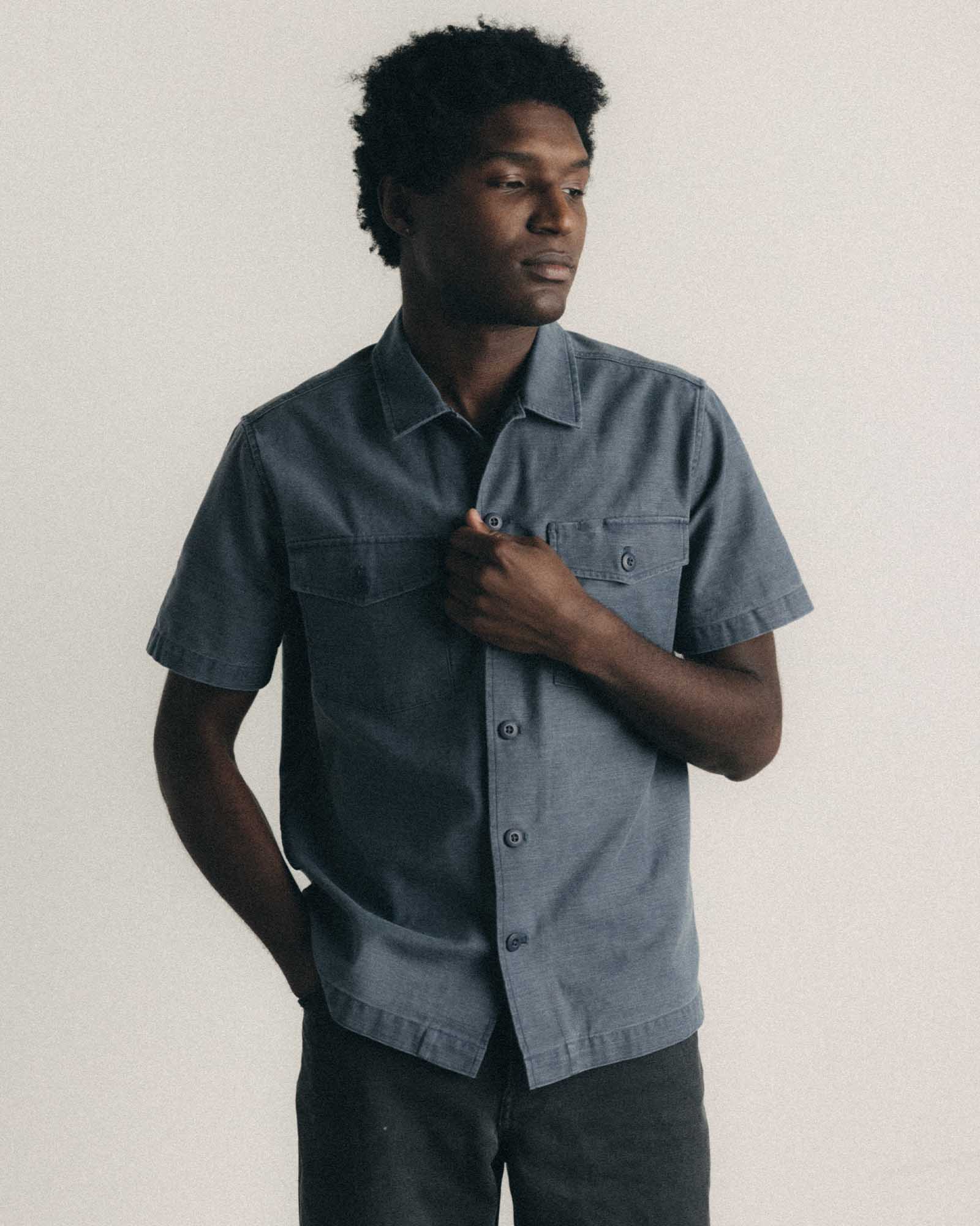 fit model posing in The Short Sleeve Surplus Shirt in Dark Navy Reverse Sateen, Wovens by Taylor Stitch