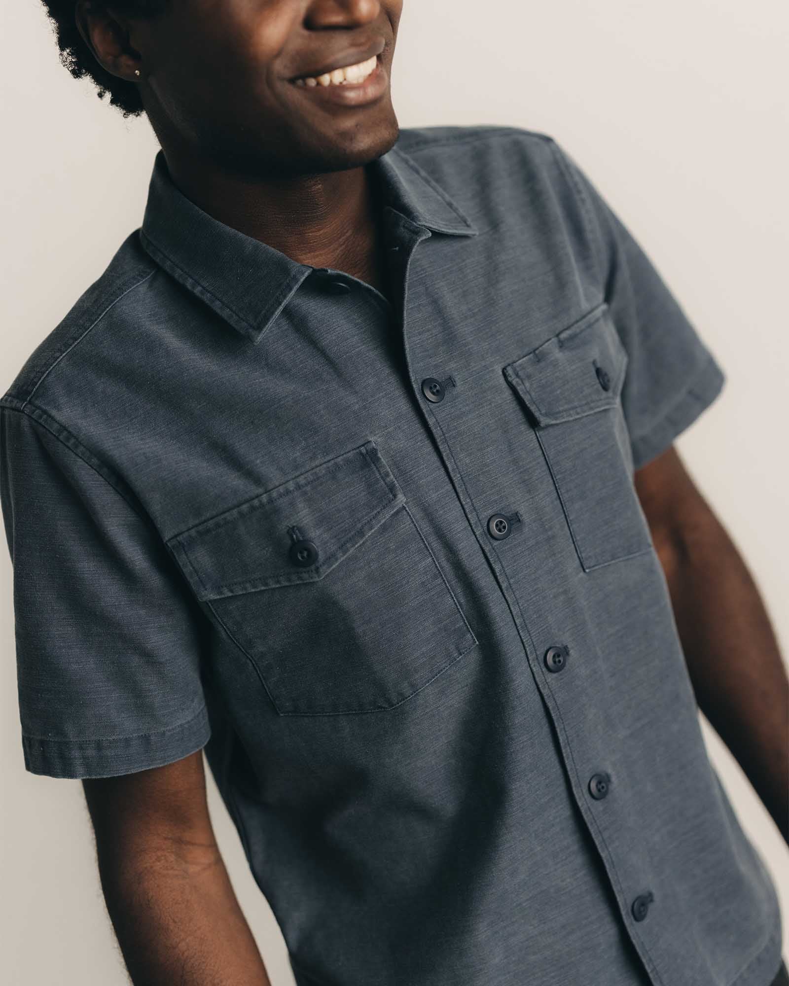 fit model showing off The Short Sleeve Surplus Shirt in Dark Navy Reverse Sateen, Wovens by Taylor Stitch