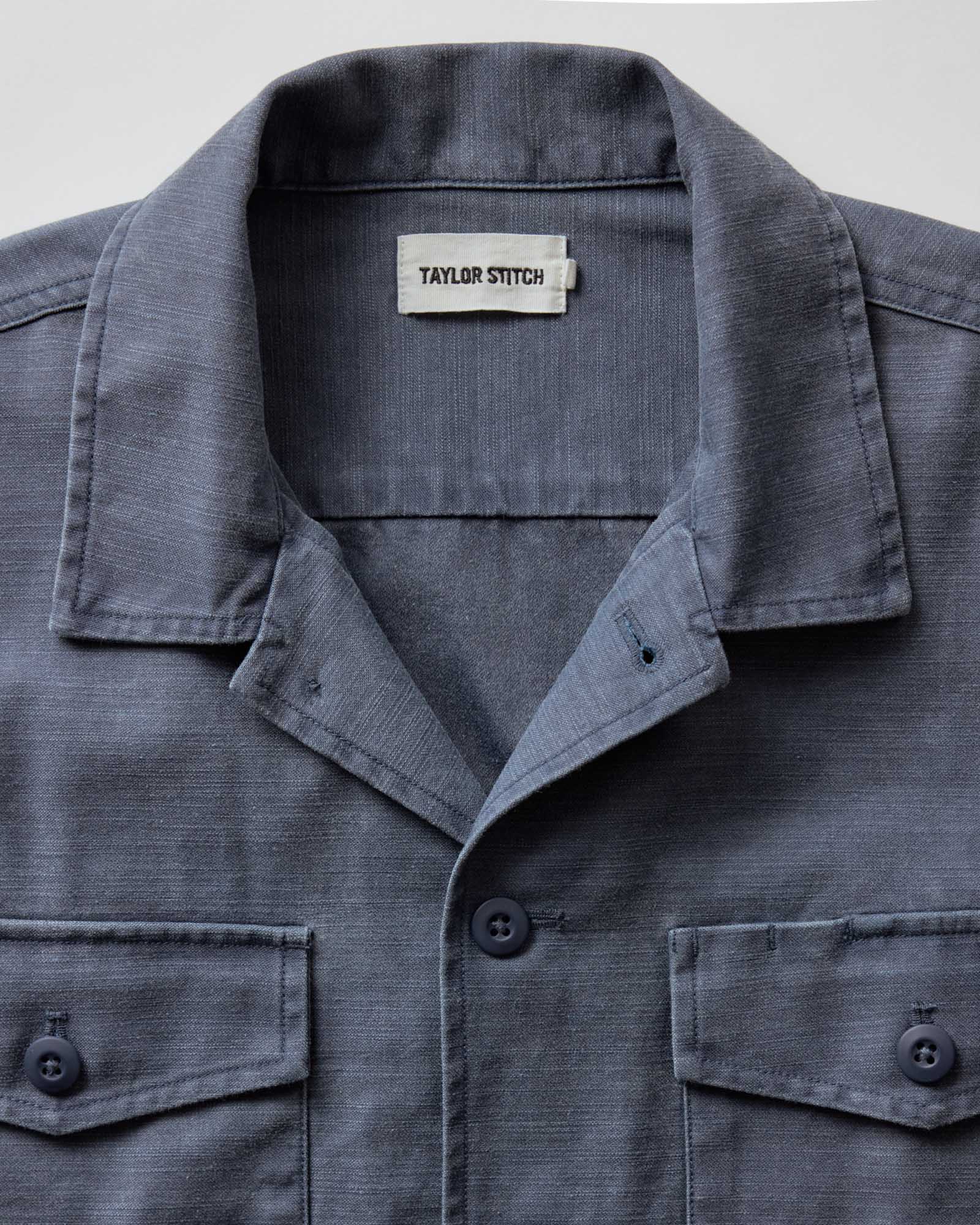material shot of the collar on The Short Sleeve Surplus Shirt in Dark Navy Reverse Sateen, Wovens by Taylor Stitch