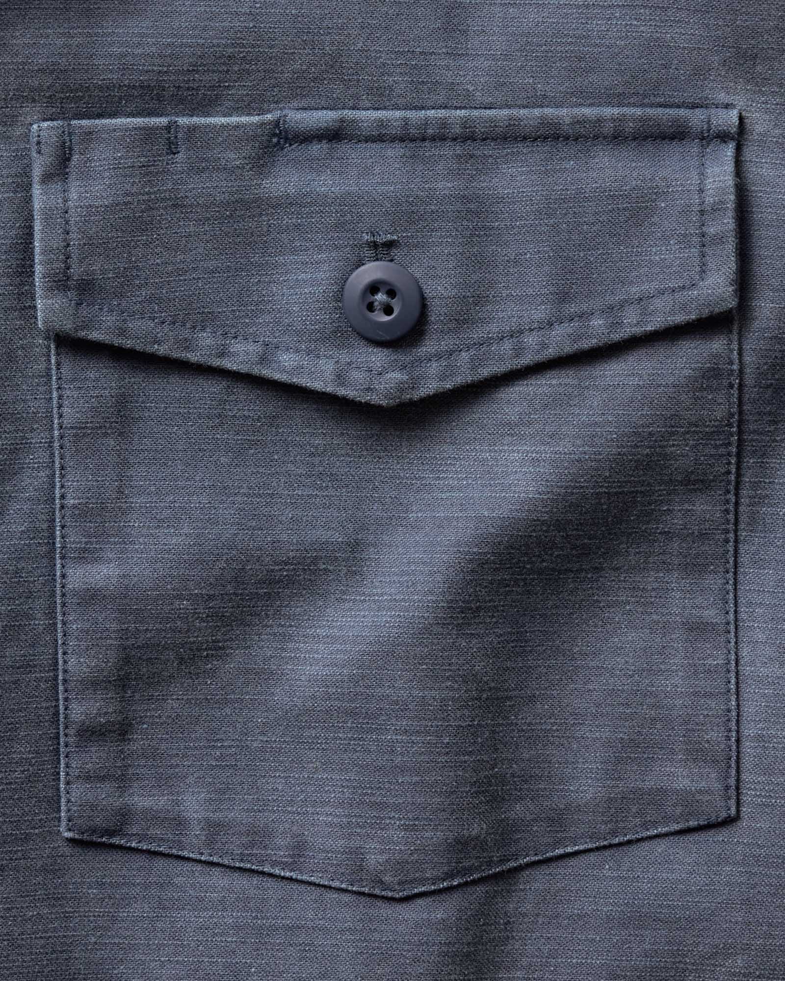 material shot of the pocket on The Short Sleeve Surplus Shirt in Dark Navy Reverse Sateen, Wovens by Taylor Stitch