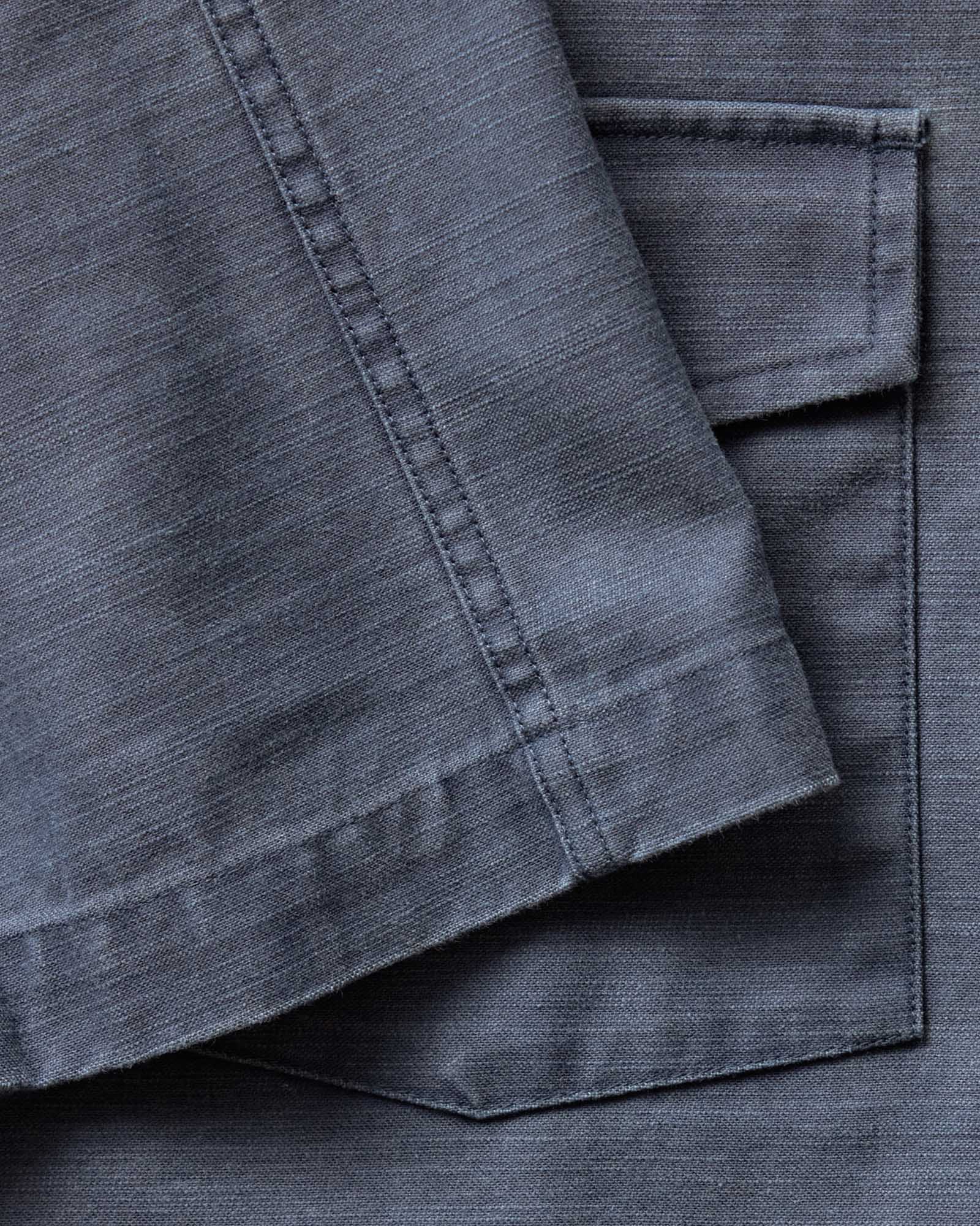 material shot of the sleeve on The Short Sleeve Surplus Shirt in Dark Navy Reverse Sateen, Wovens by Taylor Stitch