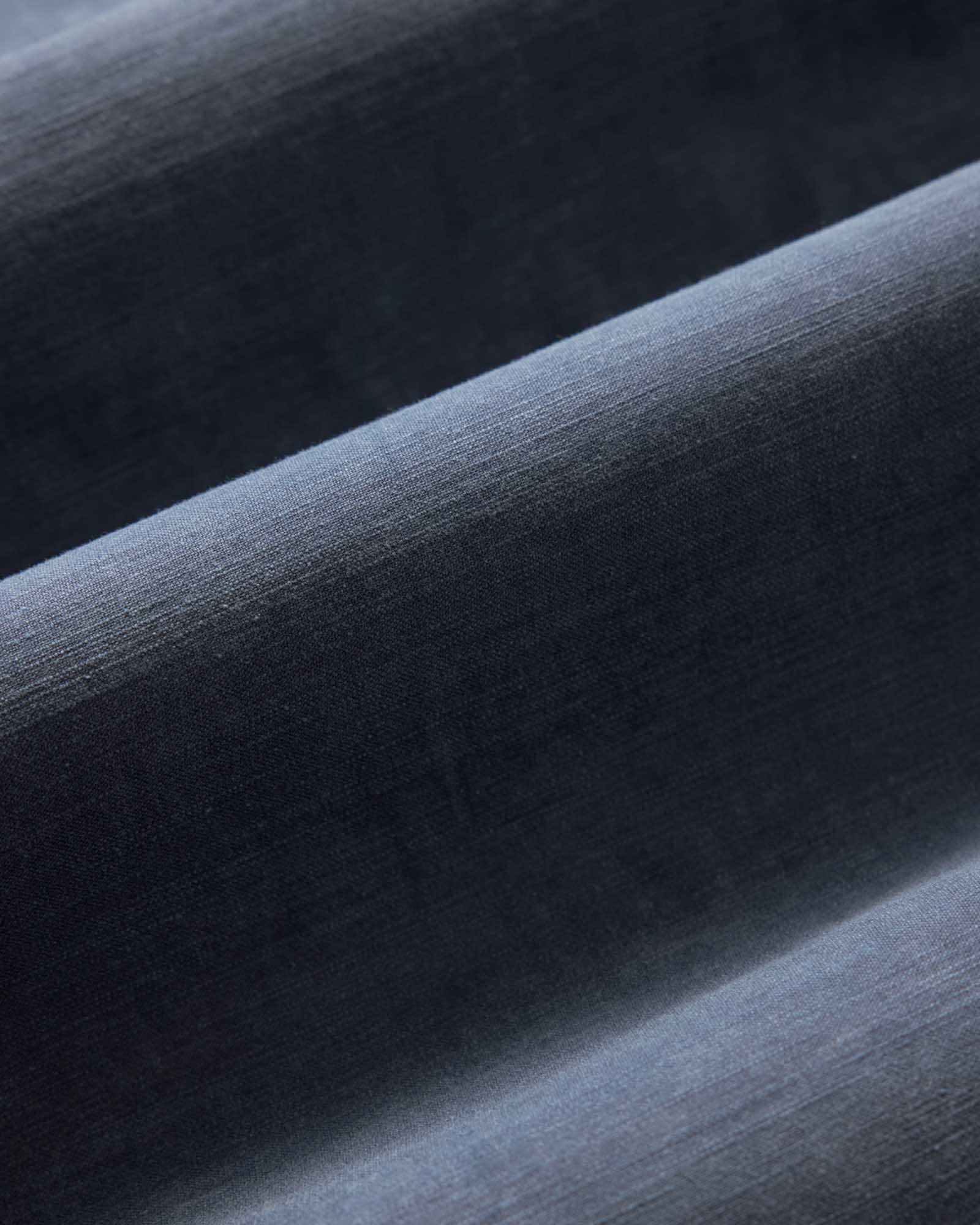 material shot of the fabric on The Short Sleeve Surplus Shirt in Dark Navy Reverse Sateen, Wovens by Taylor Stitch