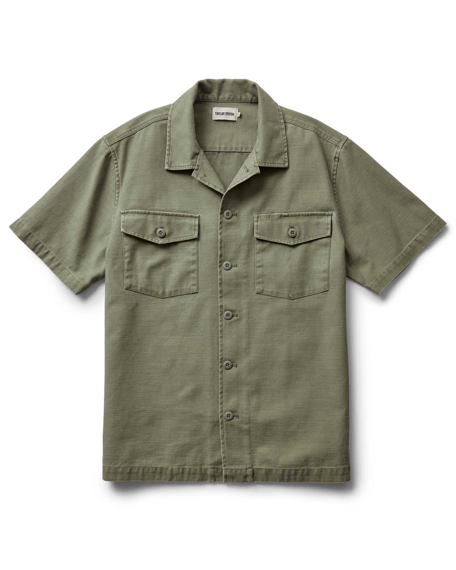 flatlay of The Short Sleeve Surplus Shirt in Field Olive Reverse Sateen, Wovens by Taylor Stitch