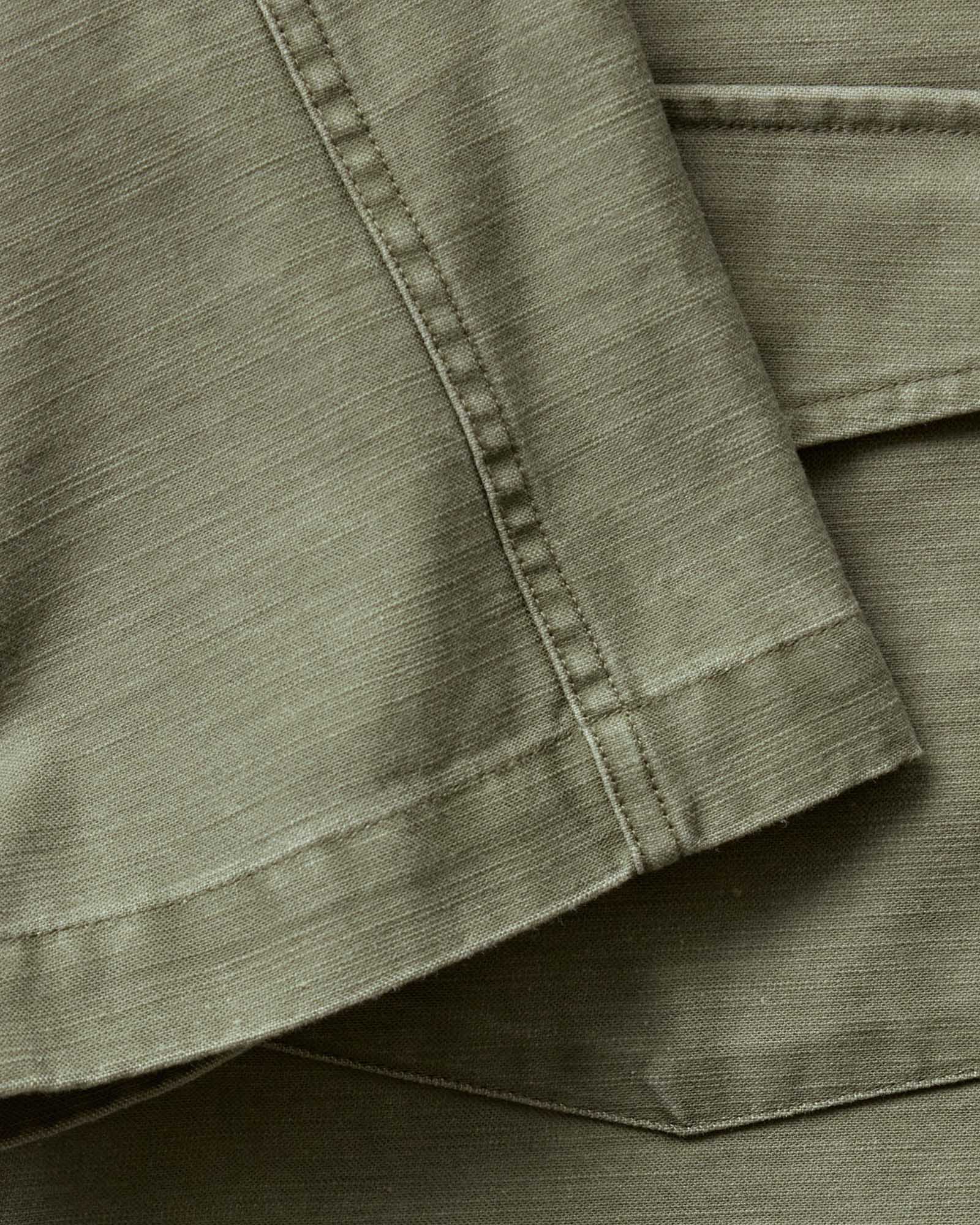 material shot of the sleeve on The Short Sleeve Surplus Shirt in Field Olive Reverse Sateen, Wovens by Taylor Stitch