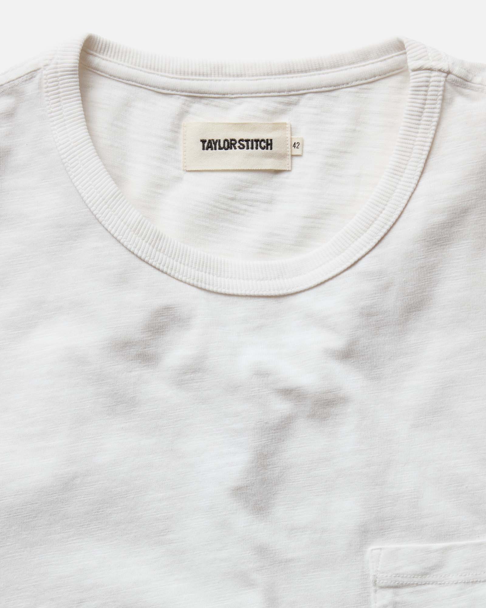 material shot of the collar on The Slub Tee in White, Knits by Taylor Stitch