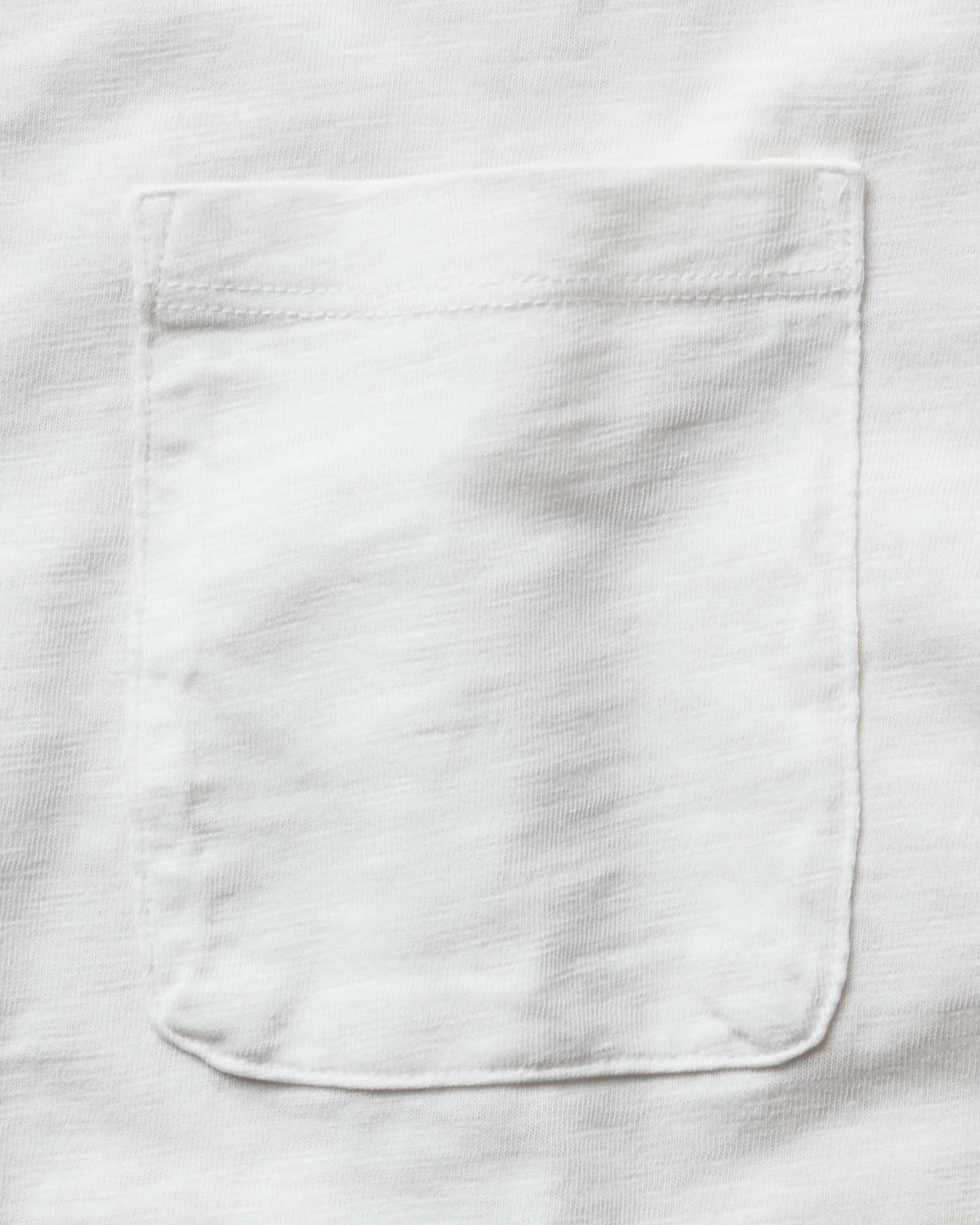 material shot of the pocket on The Slub Tee in White, Knits by Taylor Stitch
