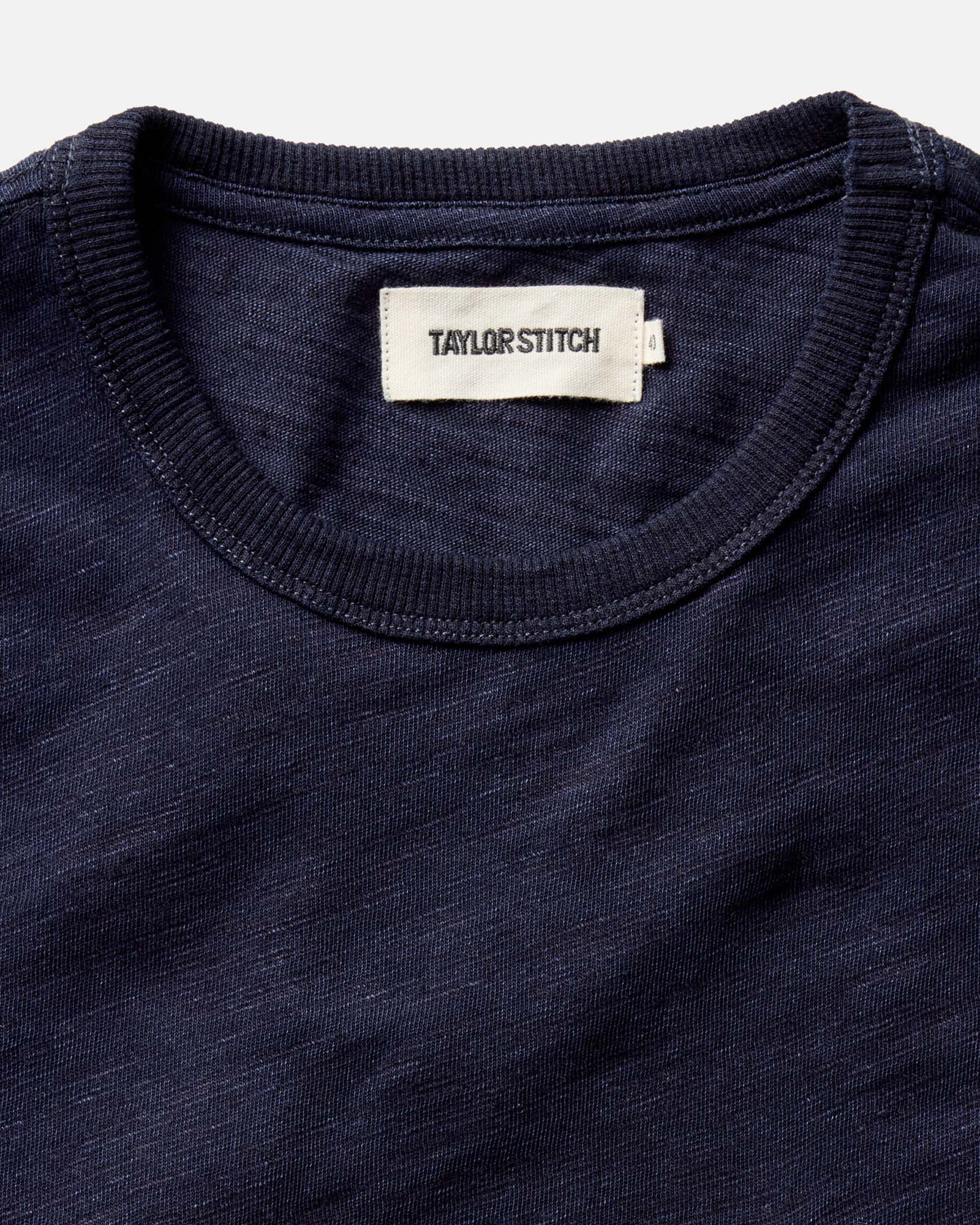 editorial image of the collar on The Organic Cotton Tee in Rinsed Indigo, Knits by Taylor Stitch