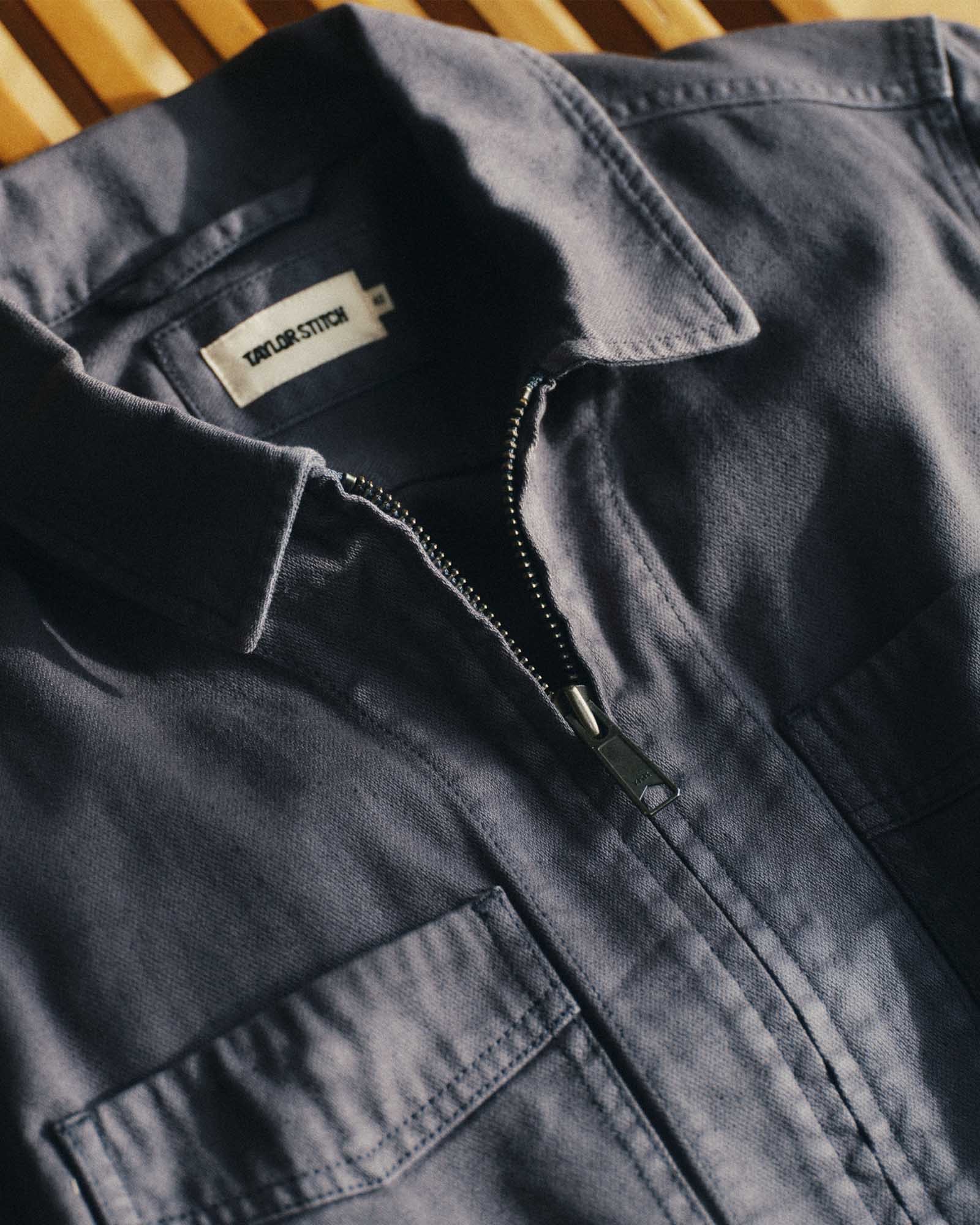 material shot of the collar on The Station Jacket in Petrol Blue Broken Twill, Outerwear by Taylor Stitch