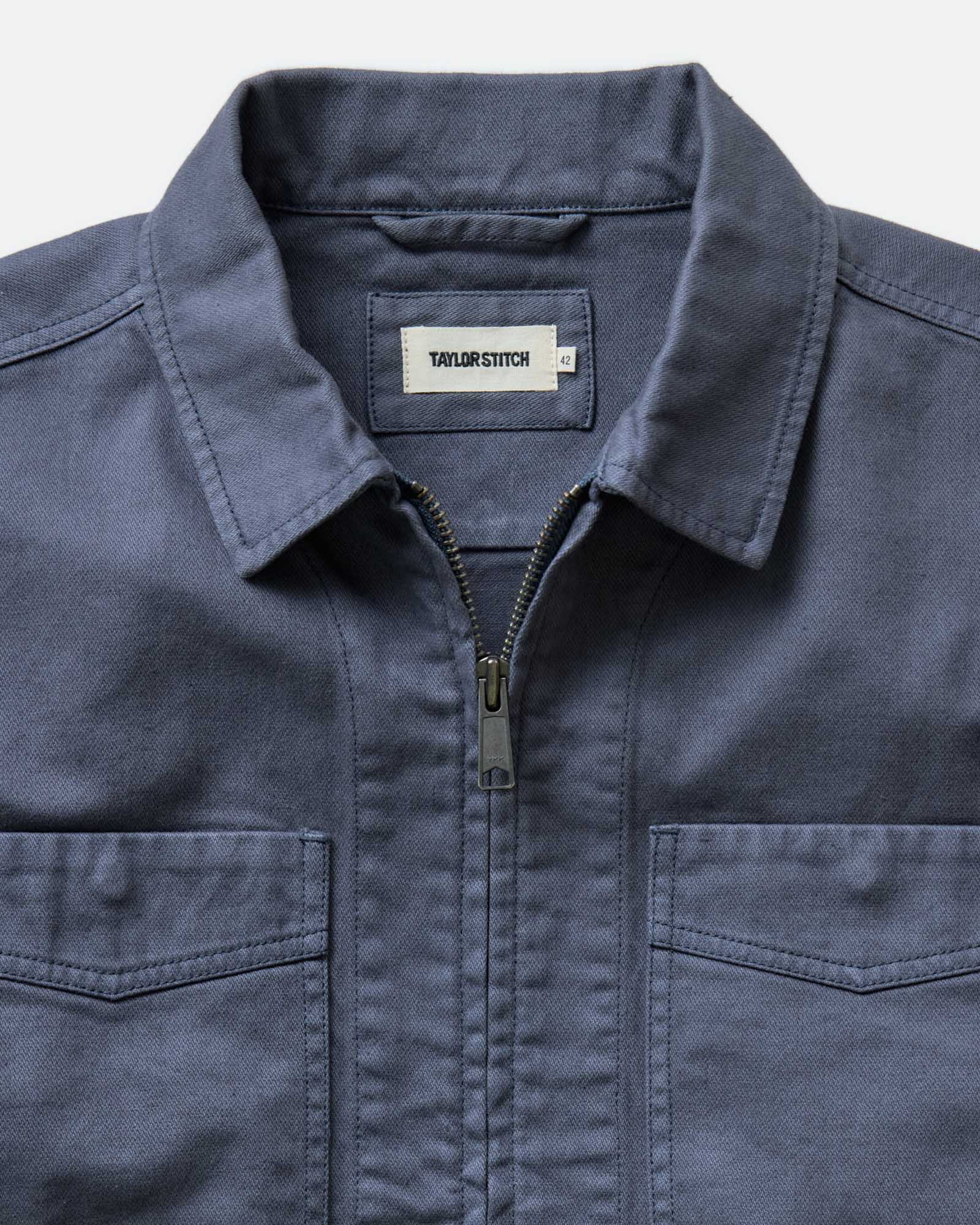 material shot of the collar on The Station Jacket in Petrol Blue Broken Twill, Outerwear by Taylor Stitch