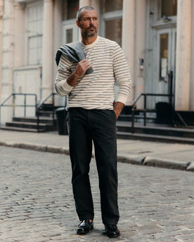 fit model posing in The Straight Foundation Pant in Organic Faded Black, Bottoms by Taylor Stitch