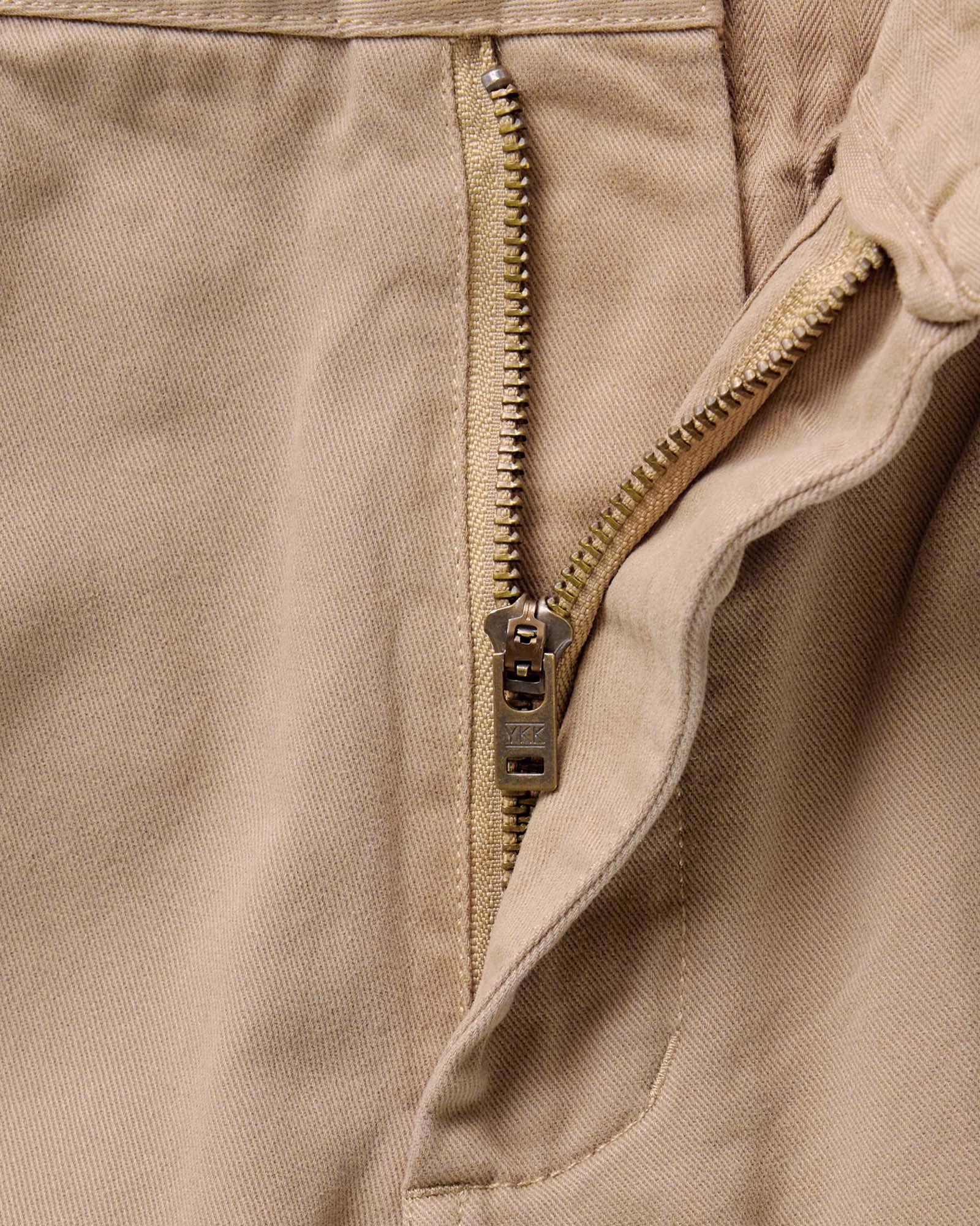 material shot of the zipper on The Straight Foundation Pant in Organic Khaki, Bottoms by Taylor Stitch