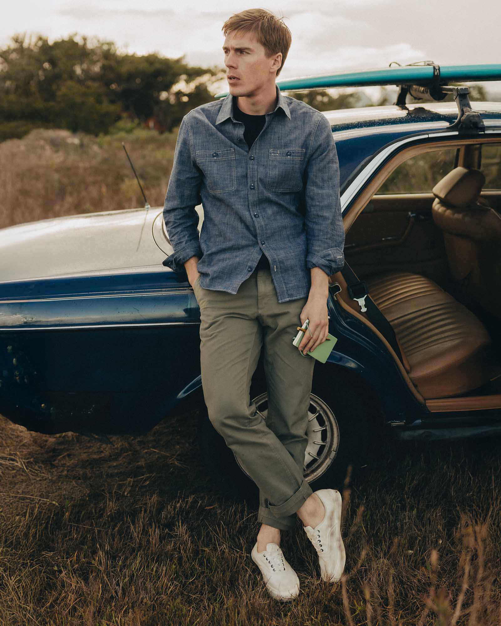 fit model posing in The Straight Foundation Pant in Organic Smoked Olive, Bottoms by Taylor Stitch