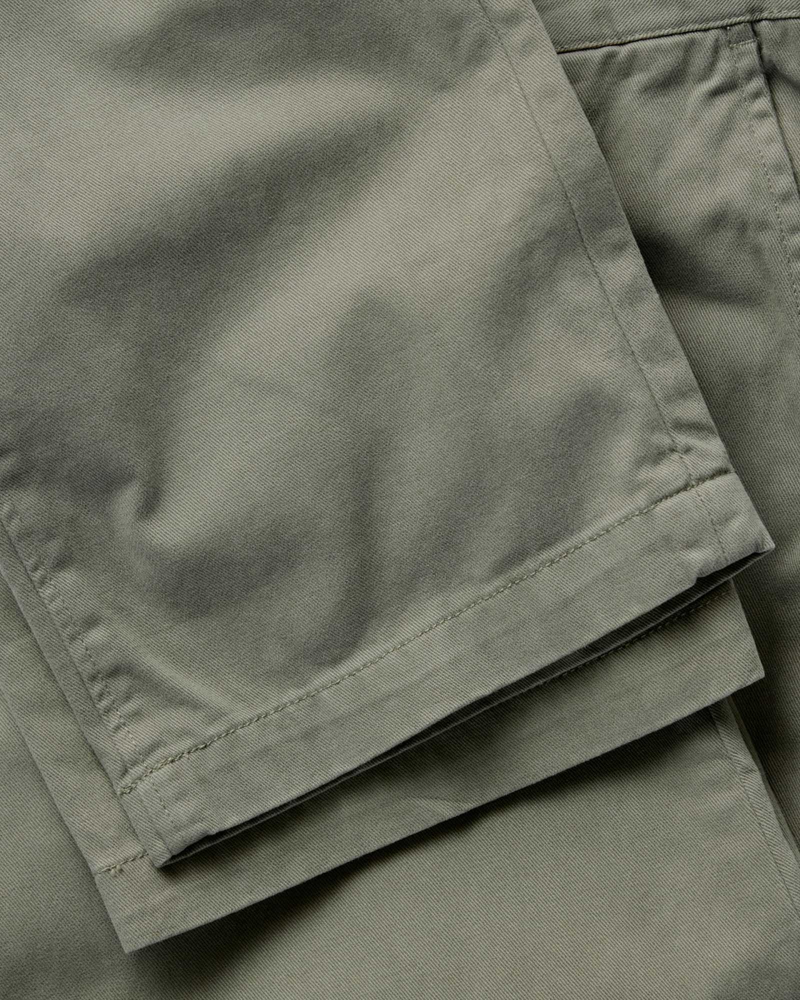 material shot of the hem on The Straight Foundation Pant in Organic Smoked Olive, Bottoms by Taylor Stitch