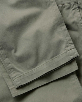 material shot of the hem on The Straight Foundation Pant in Organic Smoked Olive, Bottoms by Taylor Stitch