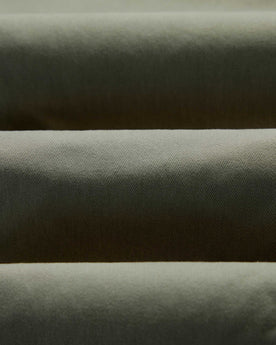 material shot of the fabric on The Straight Foundation Pant in Organic Smoked Olive, Bottoms by Taylor Stitch