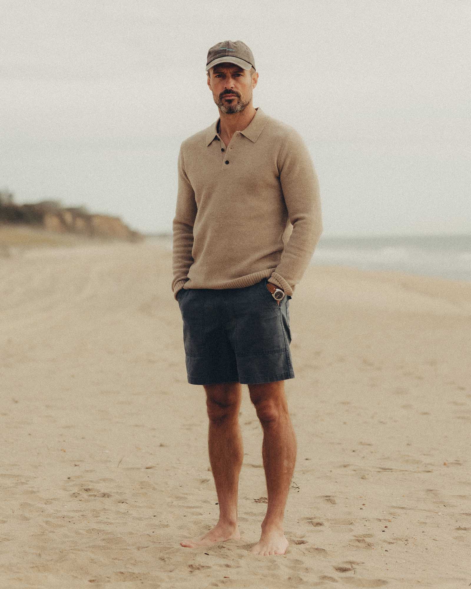 fit model posing in The Surplus Short in Dark Navy Reverse Sateen, Bottoms by Taylor Stitch