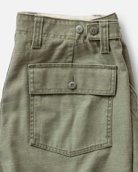 material shot of the back pocket on The Surplus Short in Field Olive Reverse Sateen, Bottoms by Taylor Stitch