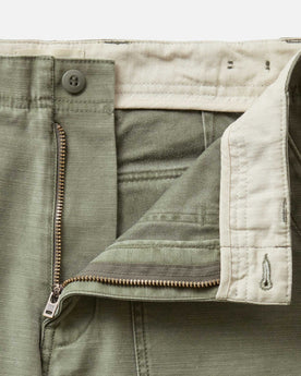 material shot of the zipper on The Surplus Short in Field Olive Reverse Sateen, Bottoms by Taylor Stitch