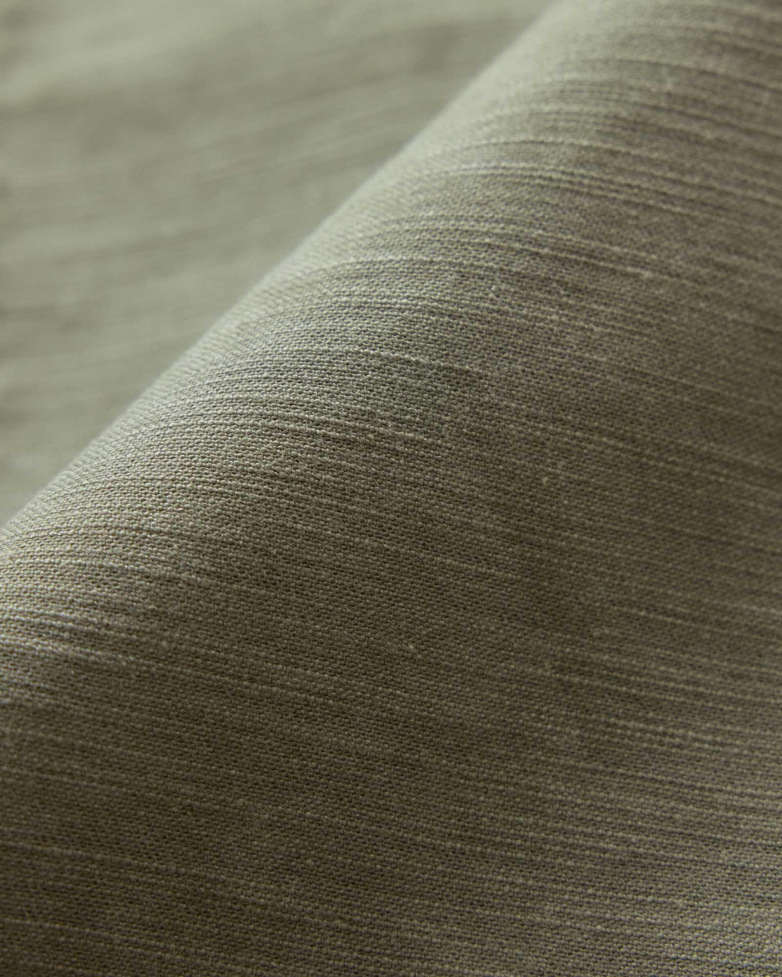 material shot of the fabric on The Surplus Short in Field Olive Reverse Sateen, Bottoms by Taylor Stitch
