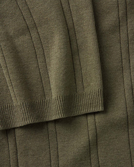 material shot of the sleeve on The Valencia Sweater Polo in Heather Cilantro Rib, Knits by Taylor Stitch