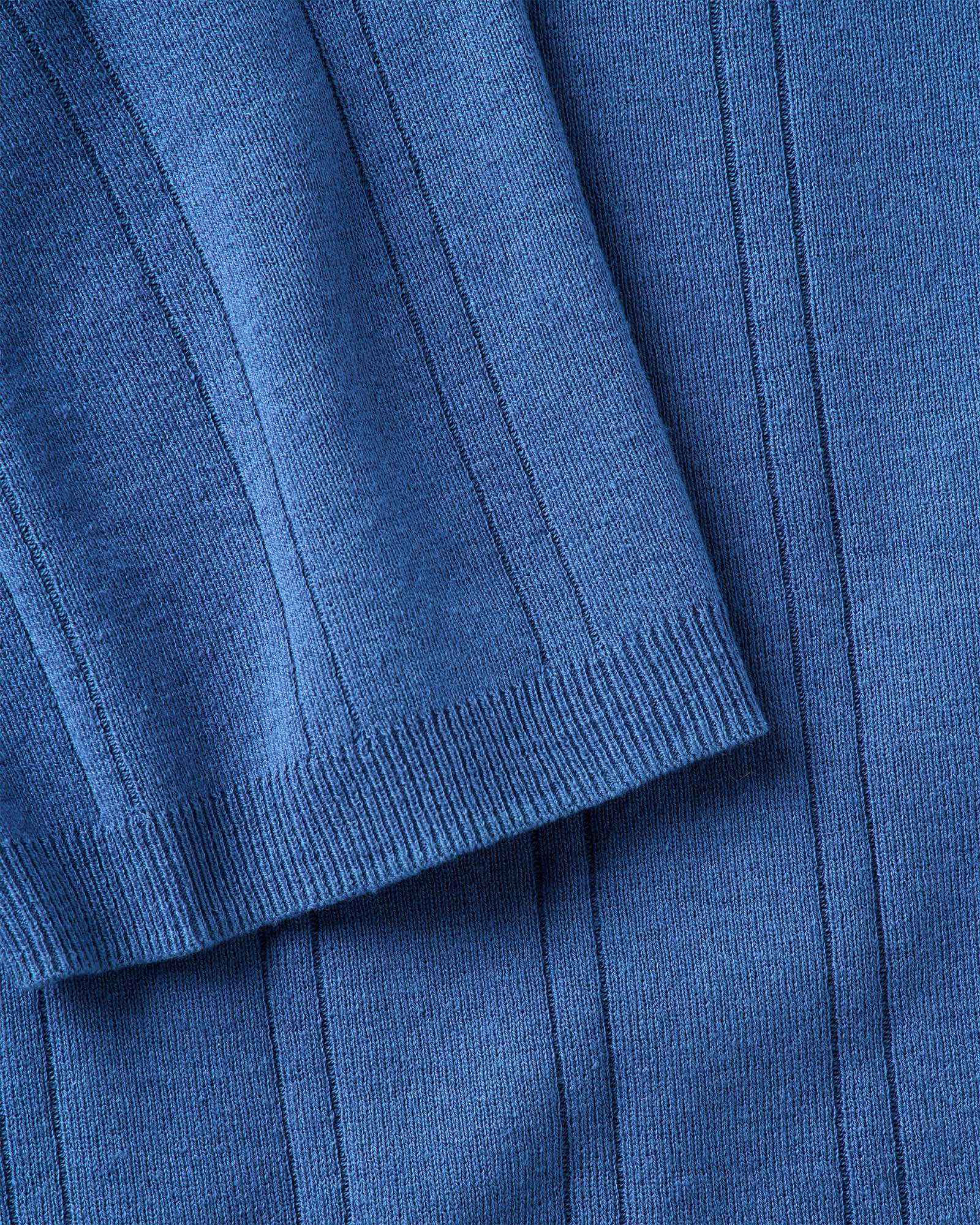 material shot of the sleeve on The Valencia Sweater Polo in Heather Clear Blue Rib, Knits by Taylor Stitch