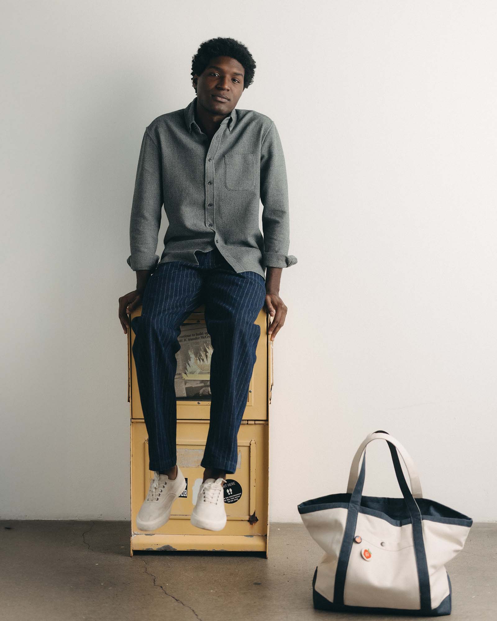 fit model sitting wearing The Jack in Charcoal Twist Waffle, Wovens by Taylor Stitch