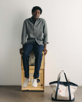 fit model sitting wearing The Jack in Charcoal Twist Waffle, Wovens by Taylor Stitch