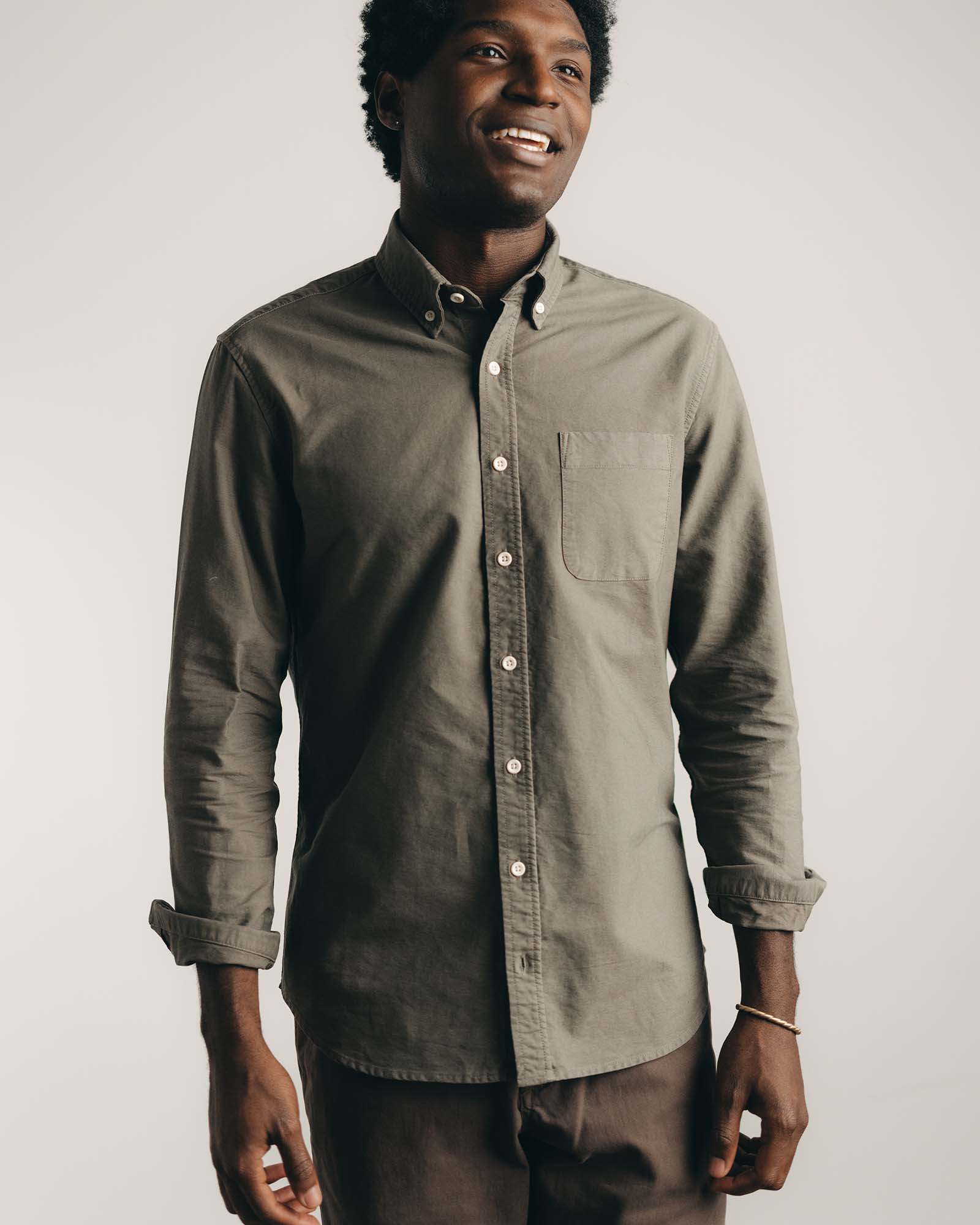 fit model posing in The Jack in Smoked Olive Oxford, Wovens by Taylor Stitch