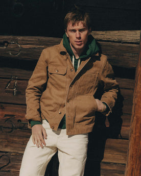 fit model posing in The Longshore Jacket in Tobacco Chipped Canvas, Outerwear by Taylor Stitch