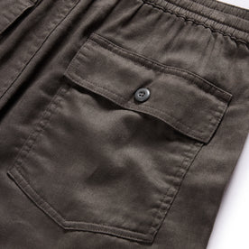 material shot of the back buttoned flap pockets on The Apres Trail Short in Granite Double Cloth