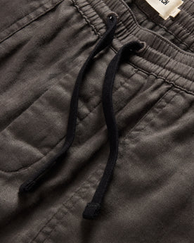 material shot of the drawcords and elasticated waist on The Apres Trail Short in Granite Double Cloth, Bottoms by Taylor Stitch