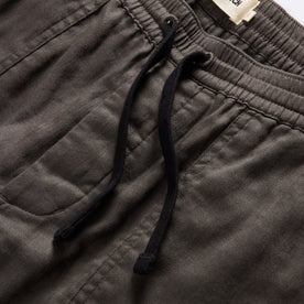 material shot of the drawcords and elasticated waist on The Apres Trail Short in Granite Double Cloth