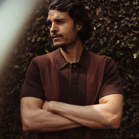 fit model crossing his arms in The Button Down Polo in Morita Seed Stitch