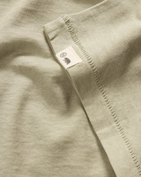 material shot of the sleeve on The Cotton Hemp Tee in Sage, Knits by Taylor Stitch