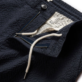 material shot of the zipper fly and drawcords on The Easy Pant in Heather Navy Seersucker