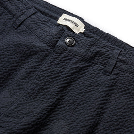 material shot of the button fly on The Easy Pant in Heather Navy Seersucker