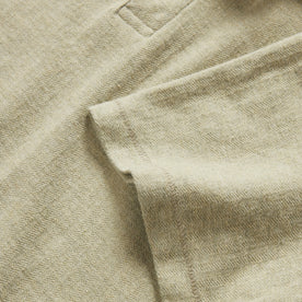 material shot of the sleeve on The Herringbone Polo in Heather Sage