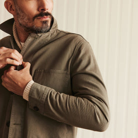 fit model buttoning up The Ojai Jacket in Organic Smoked Olive Foundation Twill