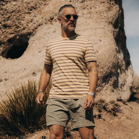 fit model walking in the desert in The Organic Cotton Tee in Vintage Gold Stripe