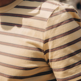 fit model showing the striped pattern on The Organic Cotton Tee in Vintage Gold Stripe