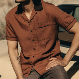 fit model sitting in The Palmer Shirt in Dried Guajillo