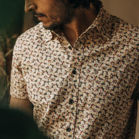 fit model showing the floral pattern and dark buttons on The Short Sleeve California in Coastal Flora