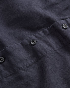 material shot of the dark buttons on The Short Sleeve Hawthorne in Marine, Wovens by Taylor Stitch