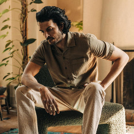 fit model sitting in The Short Sleeve Hawthorne in Sea Moss