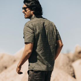 fit model showing off the back of The Short Sleeve Officer Shirt in Static Camo Double Cloth