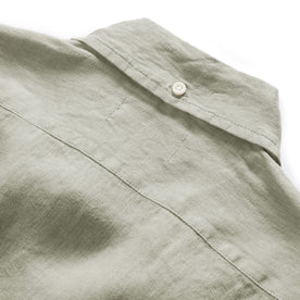 material shot of the button at the back of the collar on The Jack in Arid Eucalyptus Linen