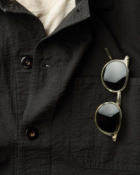 editorial image of The Legend in Crystal on a jacket, Accessories by Taylor Stitch
