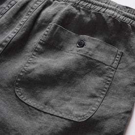 material shot of the back pocket on The Apres Short in Faded Black Hemp