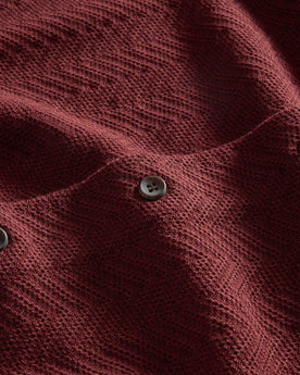 material shot of the buttons on The Button Down Polo in Dried Cherry Herringbone, Knits by Taylor Stitch