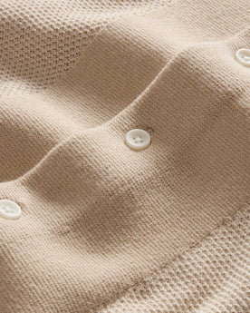 material shot of the buttons on The Button Down Polo in Faded Khaki Seed Stitch, Knits by Taylor Stitch